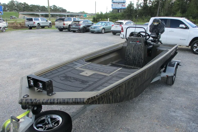 Slide: The Image of 2026 Gator Tail 1854 Extreme CC boat on trailer in parking lot. - 2