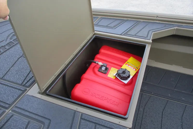 Slide: The Image of 2026 Gator Tail 1854 Extreme CC boat storage compartment with red fuel tank. - 5