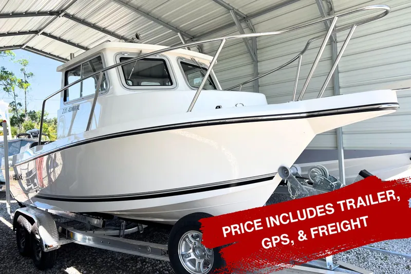 The Image of 2026 Defiance Admiral 220 EX boat on trailer, displayed outdoors under clear blue sky. - 0