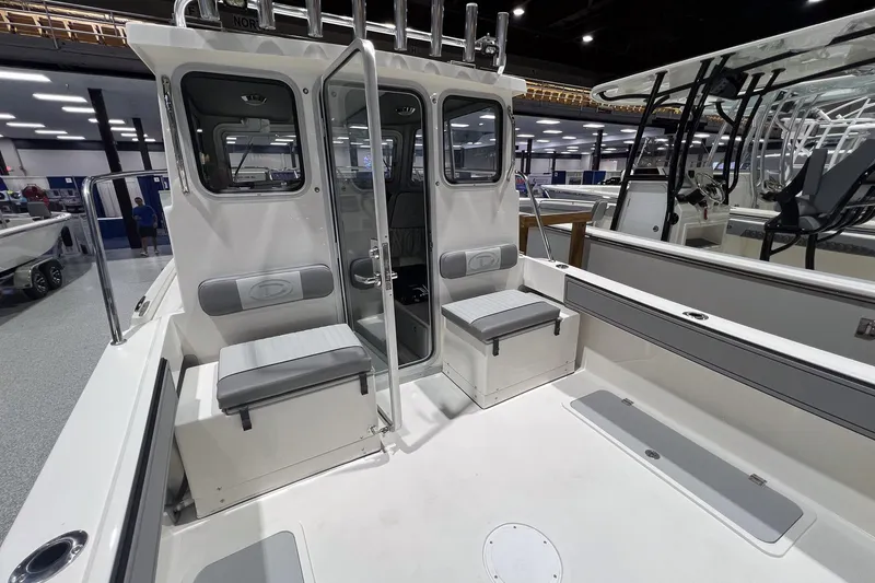 Slide: The Image of Gray leather seat in 2026 Defiance Admiral 220 EX boat interior. - 10