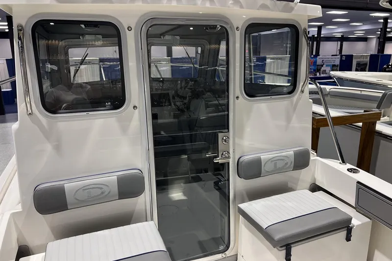 Slide: The Image of Interior of Defiance Admiral 220 EX 2026 with gray cushions. - 12