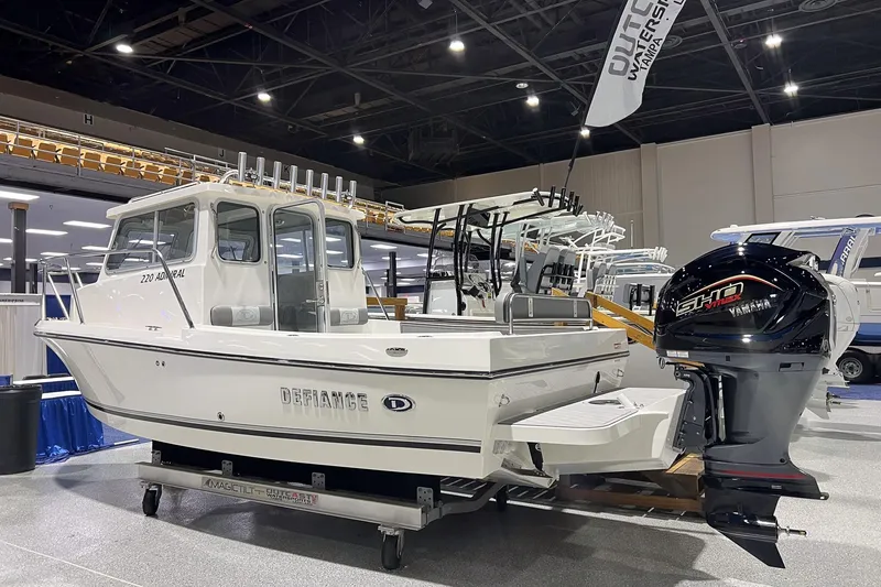 Slide: The Image of 2026 Defiance Admiral 220 EX boat deck with storage compartments and clean design. - 4