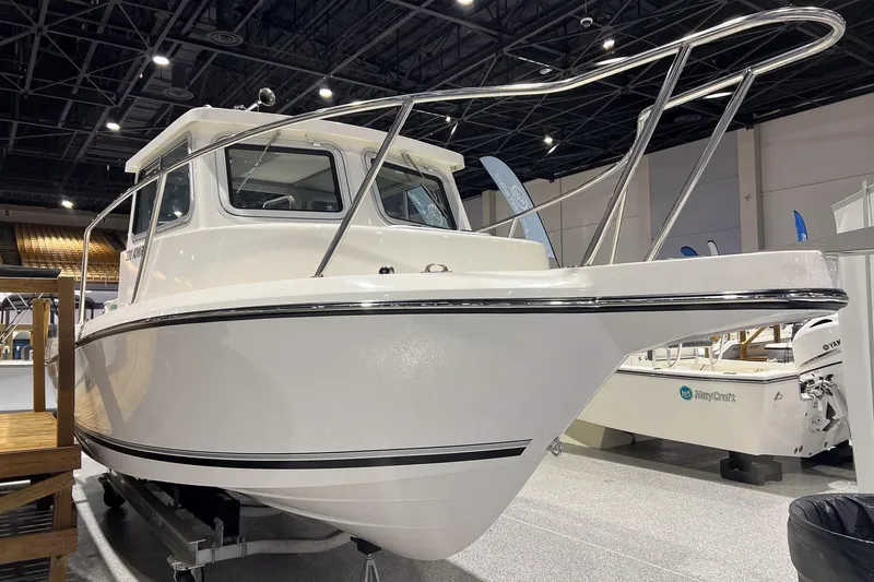 Slide: The Image of Interior of 2026 Defiance Admiral 220 EX boat with seating and steering wheel. - 6