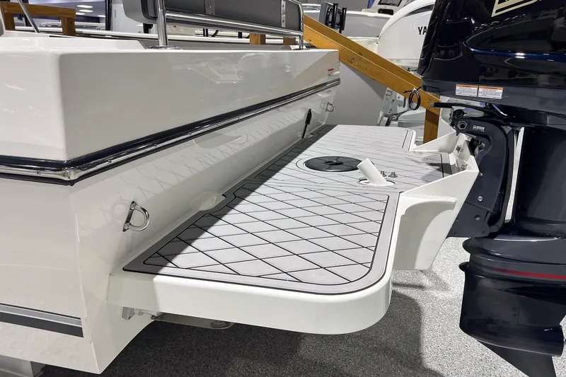 Slide: The Image of Interior of 2026 Defiance Admiral 220 EX boat with modern seating and steering wheel. - 8