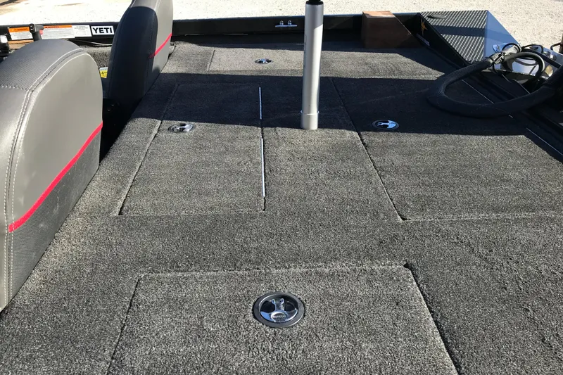 Slide: The Image of 2016 Ranger RT188 boat interior with carpeted deck and storage compartments. - 20