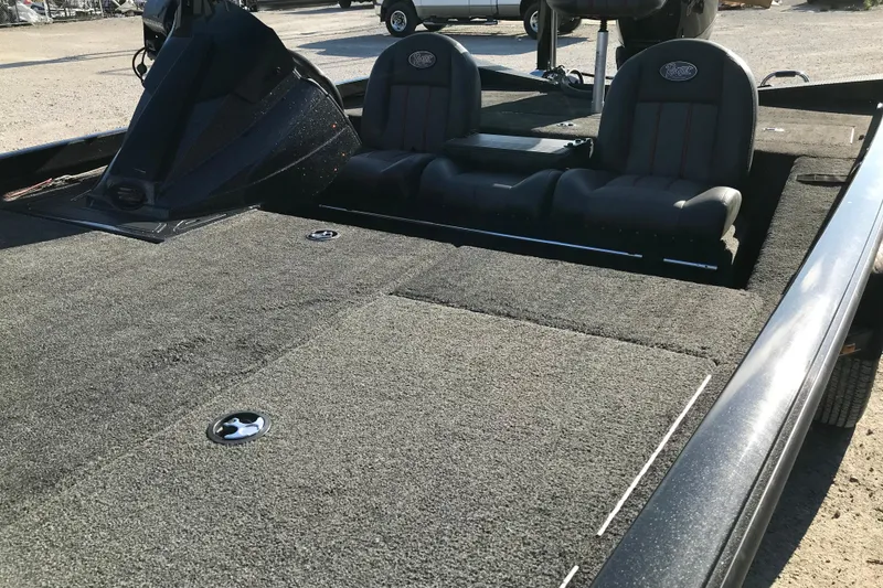 Slide: The Image of 2016 Ranger RT188 boat interior with dual seats and carpeted deck. - 23