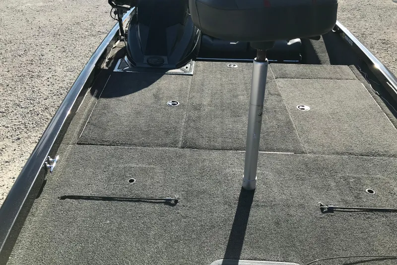 Slide: The Image of 2016 Ranger RT188 boat interior with carpeted deck and seating. - 24