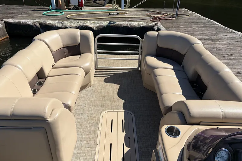 Slide: The Image of 2021 G3 SunCatcher Fusion 325RCX pontoon boat with beige seating at dock. - 6