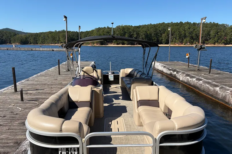 Slide: The Image of 2021 G3 SunCatcher Fusion 325RCX pontoon boat interior with beige seating and steering console. - 9