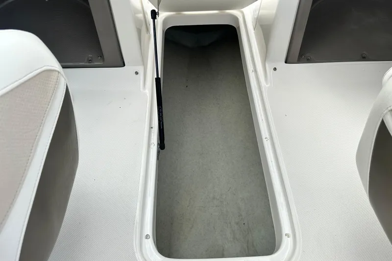 Slide: The Image of Blue trailer hitch for 2006 Rinker 226 Captiva Bowrider on asphalt. - 21