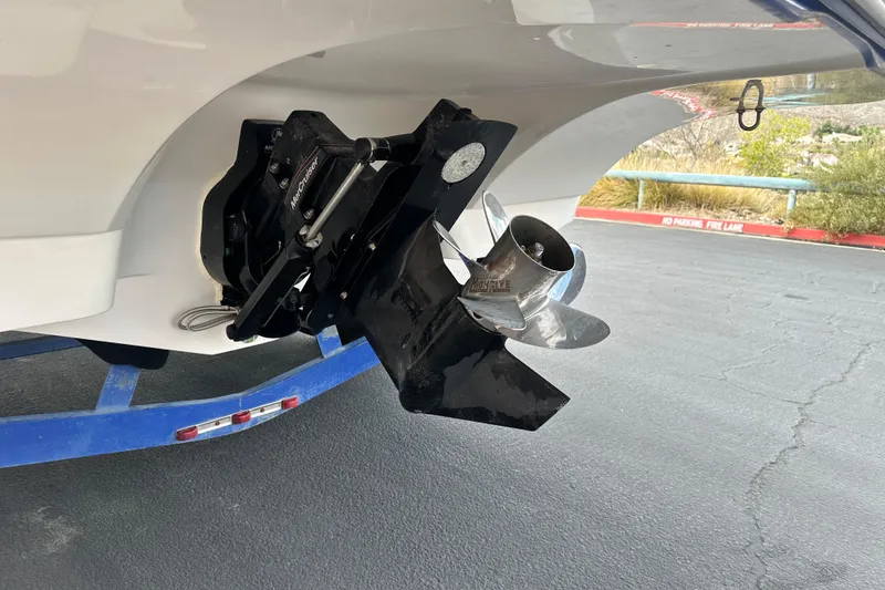 Slide: The Image of 2006 Rinker 226 Captiva Bowrider boat propeller and outdrive on a trailer. - 5