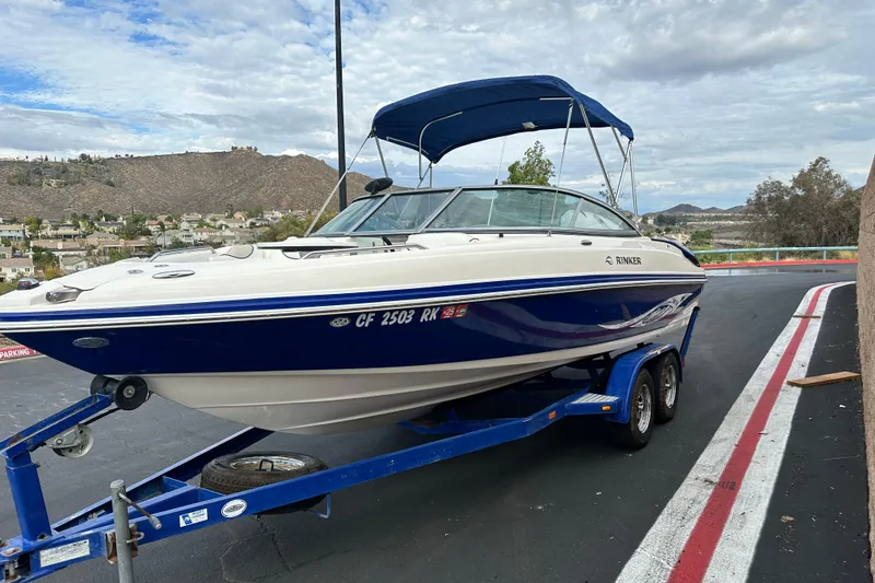 Slide: The Image of 2006 Rinker 226 Captiva Bowrider interior with seating and table. - 7