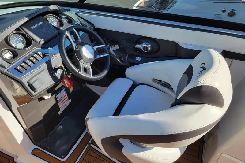 Slide: The Image of 2018 Monterey 278SS Super Sport boat cockpit with steering wheel and control panel. - 10
