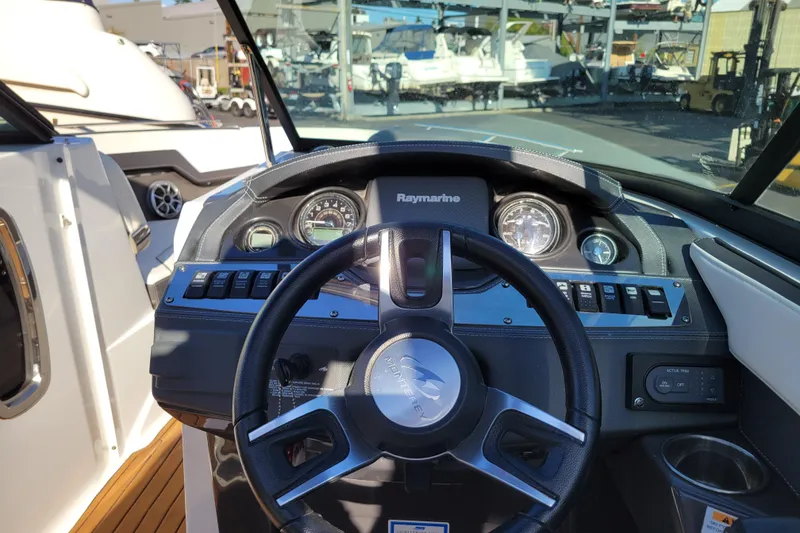 Slide: The Image of 2018 Monterey 278SS Super Sport boat dashboard with steering wheel and gauges. - 11