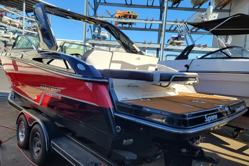 Slide: The Image of 2018 Monterey 278SS Super Sport boat on trailer in marina setting. - 3