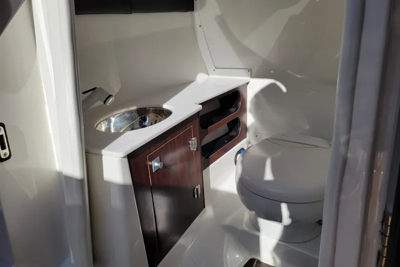 Slide: The Image of 2018 Monterey 278SS Super Sport boat bathroom with sink and toilet. - 31