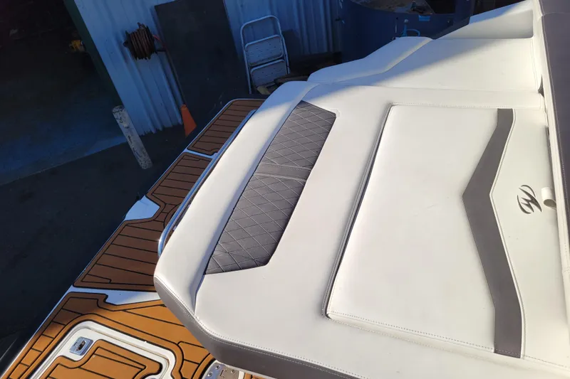 Slide: The Image of 2018 Monterey 278SS Super Sport boat interior with cushioned seating and teak flooring. - 32