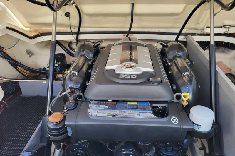 Slide: The Image of Engine compartment of a 2018 Monterey 278SS Super Sport boat, featuring a Mercury 350 engine. - 35