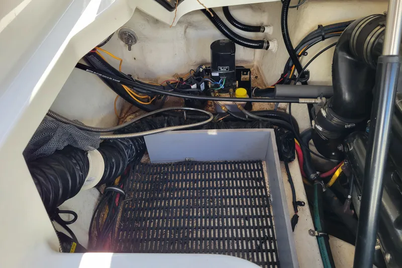 Slide: The Image of Engine compartment of a 2018 Monterey 278SS Super Sport boat, showing wiring and components. - 36