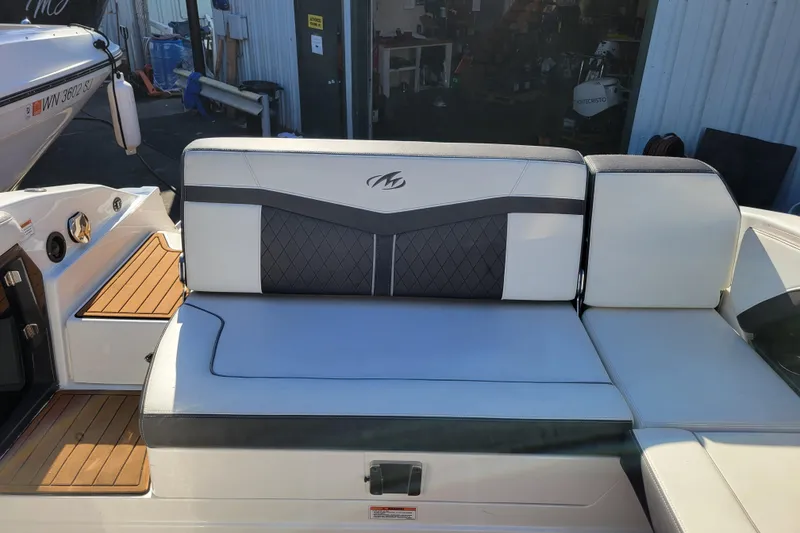 Slide: The Image of 2018 Monterey 278SS Super Sport boat interior with cushioned seating and teak flooring. - 7