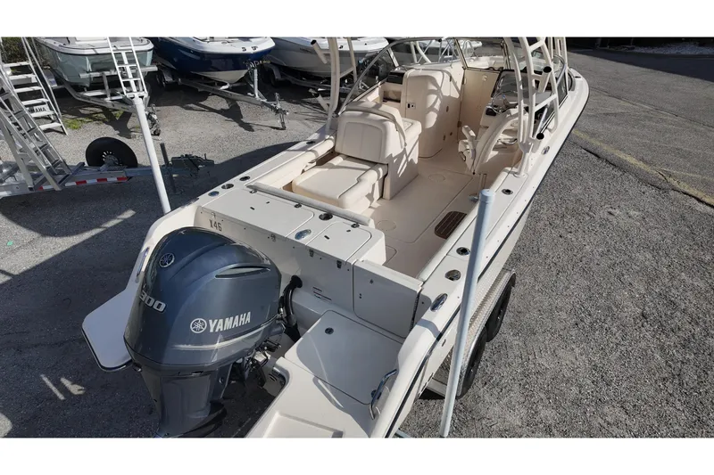 Slide: The Image of 2019 Grady-White Freedom 235 boat with Yamaha engine, parked on a trailer. - 10