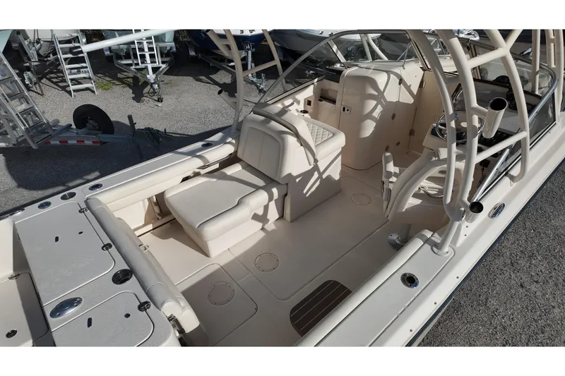 Slide: The Image of 2019 Grady-White Freedom 235 boat interior with seating and helm station. - 11
