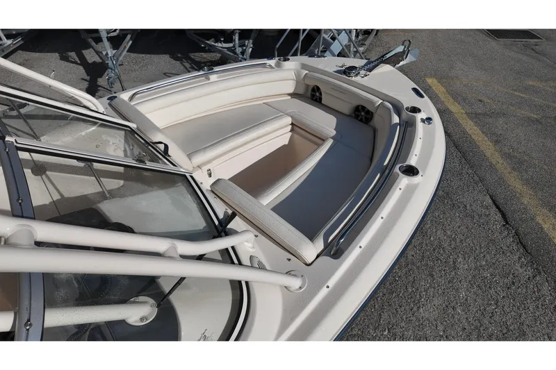 Slide: The Image of 2019 Grady-White Freedom 235 boat interior with cushioned seating and stainless steel fixtures. - 13