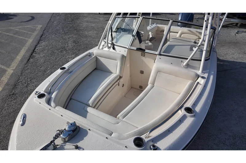 Slide: The Image of 2019 Grady-White Freedom 235 boat interior with cushioned seating and windshield. - 15
