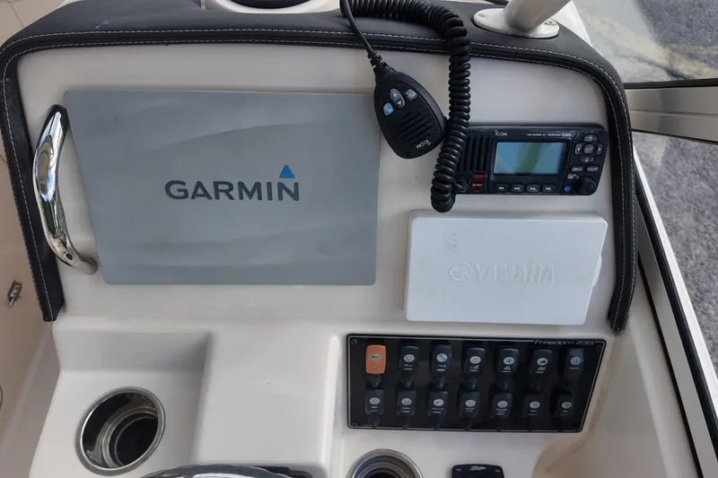 Slide: The Image of 2019 Grady-White Freedom 235 dashboard with Garmin and Yamaha electronics. - 21
