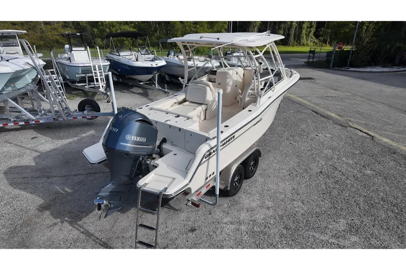 Slide: The Image of 2019 Grady-White Freedom 235 boat with Yamaha engine on trailer in parking lot. - 4