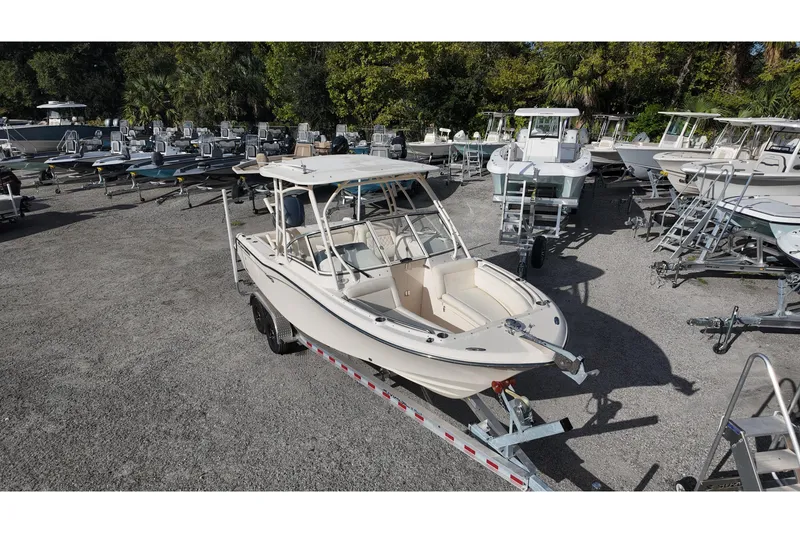 Slide: The Image of 2019 Grady-White Freedom 235 boat on trailer in a marina lot. - 7