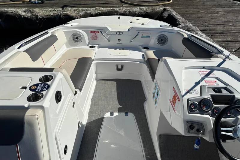 Slide: The Image of Interior of a 2021 Tahoe 1950 boat with seating and control panel. - 6