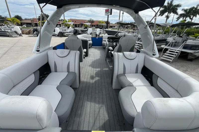 Slide: The Image of 2021 Godfrey Monaco 255 RL Tri Toon boat with luxurious seating and modern design. - 8