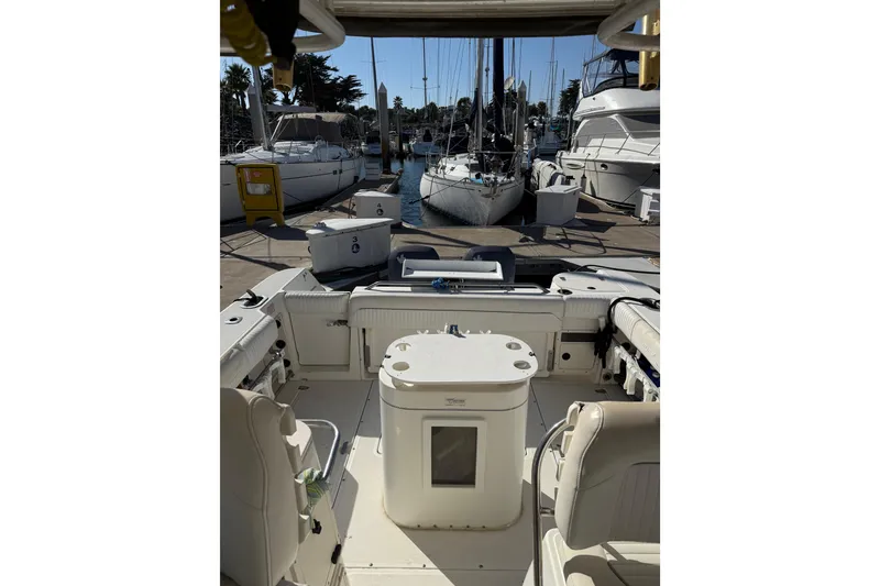 Slide: The Image of Boston Whaler 295 Conquest 2000 with dual V250 engines docked at marina. - 3