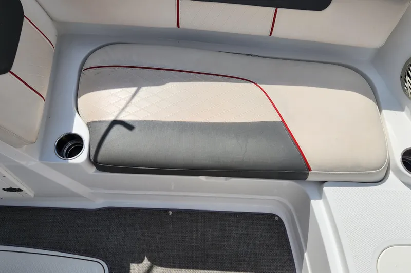 Slide: The Image of Boat seating area in a 2021 Tahoe 1950, featuring cup holders and stylish upholstery. - 11