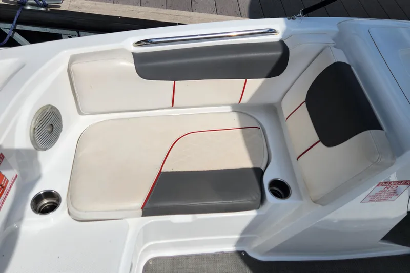 Slide: The Image of Tahoe 1950 boat seating area, 2021 model, featuring white and gray upholstery with red accents. - 12