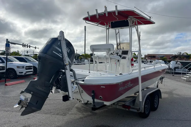 Slide: The Image of 2005 NauticStar 2200 Nautic Bay boat on trailer, featuring Yamaha outboard motor. - 4