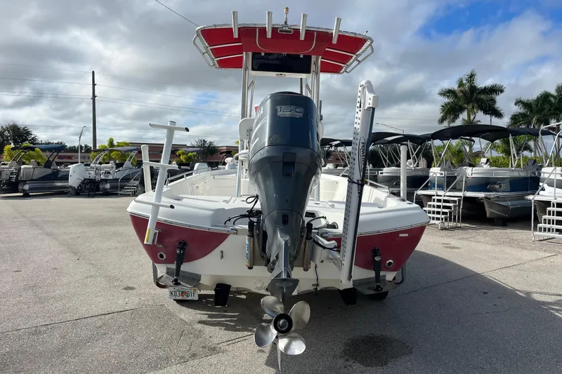 Slide: The Image of 2005 NauticStar 2200 Nautic Bay boat with Yamaha outboard motor in a marina setting. - 5