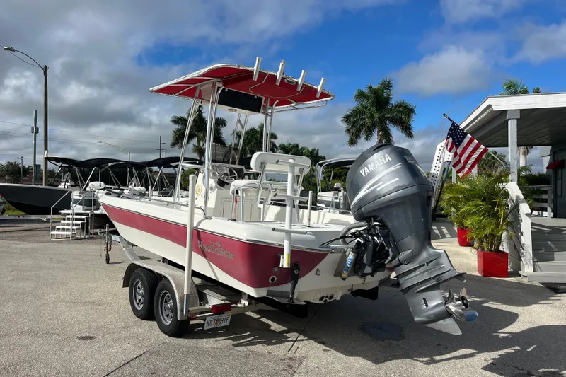 Slide: The Image of 2005 NauticStar 2200 Nautic Bay boat with Yamaha outboard motor on trailer. - 6