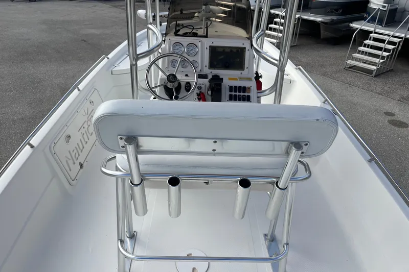 Slide: The Image of 2005 NauticStar 2200 Nautic Bay boat interior with steering wheel and control panel. - 8