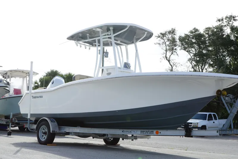 The Image of 2019 Tidewater 210 LXF boat on trailer, parked outdoors, side view. - 1