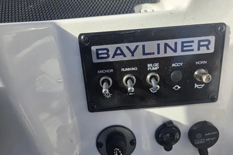 Slide: The Image of Control panel of 2024 Bayliner M19 boat with switches for anchor, running, bilge pump, and horn. - 11