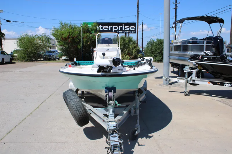 Slide: The Image of 2022 Mako 18 LTS boat on trailer in parking lot, sunny day. - 11