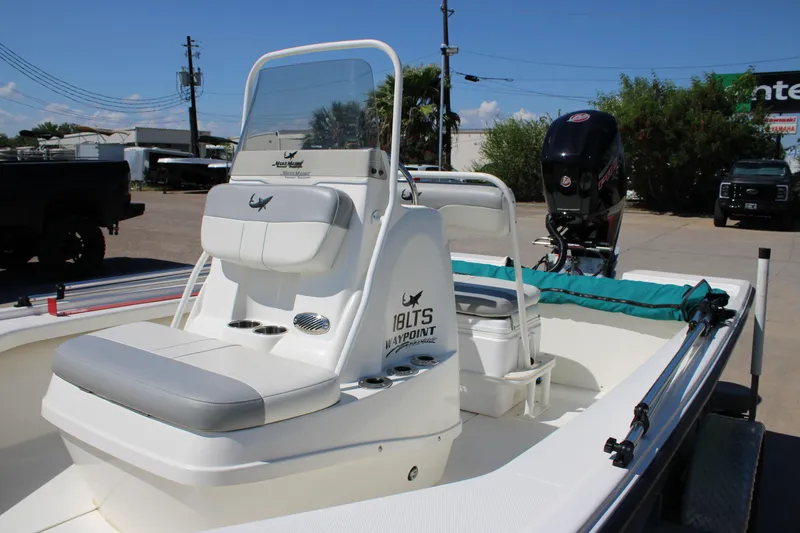Slide: The Image of 2022 Mako 18 LTS boat with seating and outboard motor in a sunny outdoor setting. - 3