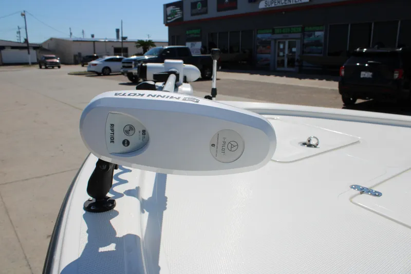 Slide: The Image of 2022 Mako 18 LTS boat with Minn Kota Riptide trolling motor in a parking lot. - 4