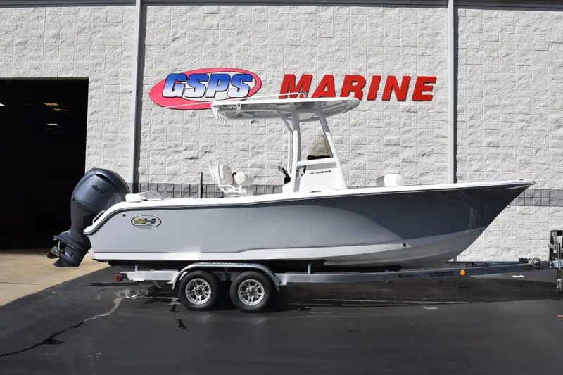 The Image of 2026 Sea Hunt Ultra 229 boat on trailer at GSPS Marine dealership. - 1