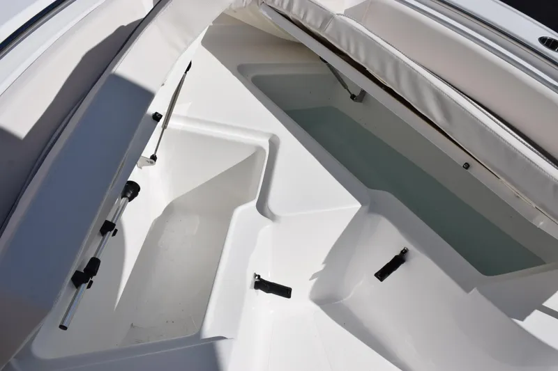 Slide: The Image of 2026 Sea Hunt Ultra 229 boat interior storage compartments. - 15