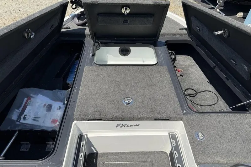 Slide: The Image of Open storage compartment in a 2014 Skeeter FX20 boat. - 12