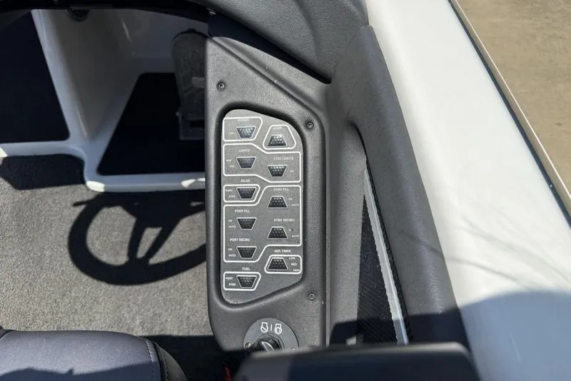 Slide: The Image of 2014 Skeeter FX20 boat storage compartments open, showcasing organized interior space. - 13