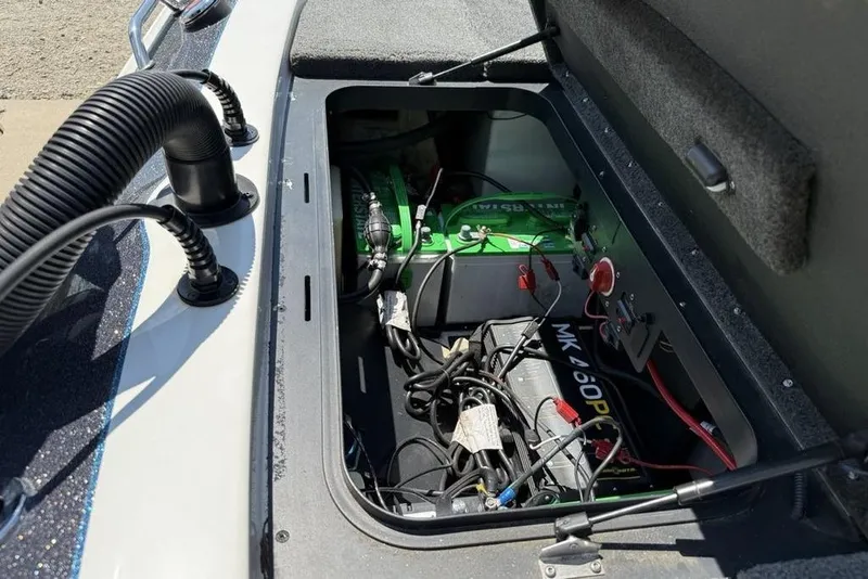 Slide: The Image of 2014 Skeeter FX20 boat dashboard with steering wheel and Humminbird fishfinder. - 25